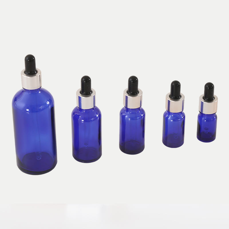 Botella de aceite esencial de vidrio azul