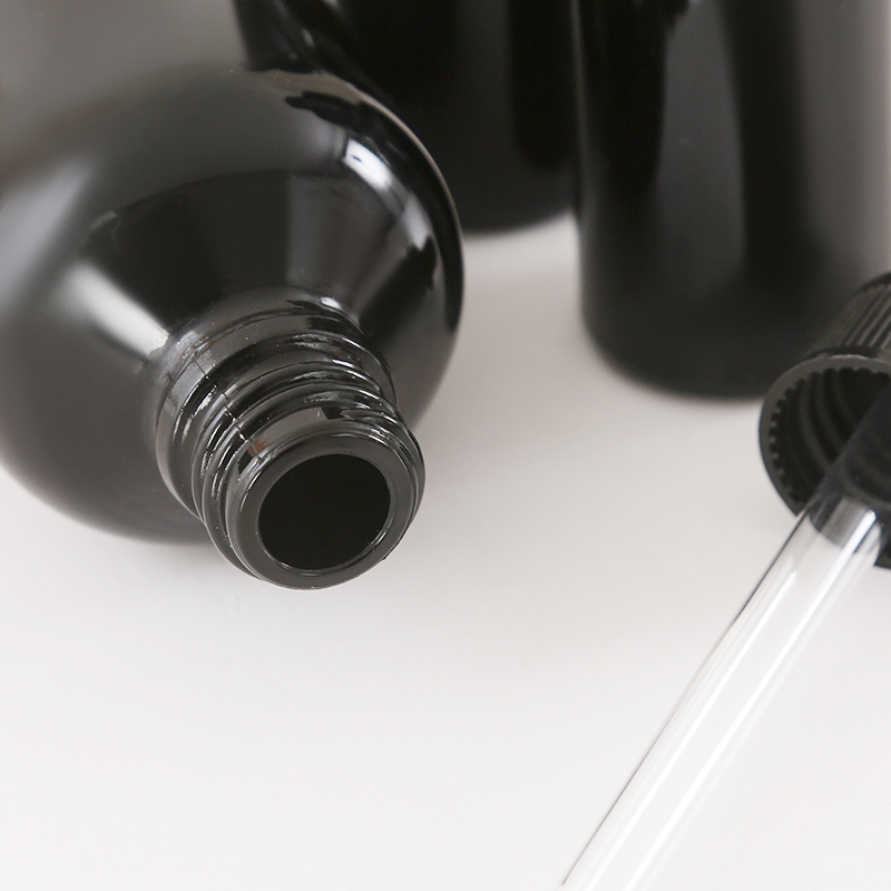 Botella de aceite esencial de vidrio negro